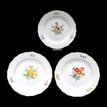 Three Meissen wall plates with colorful flowers  