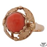 Elaborately decorated ring with coral cabochon