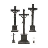 Lot of five crucifixes, German or Austro-Hungarian iron foundry, 19th century