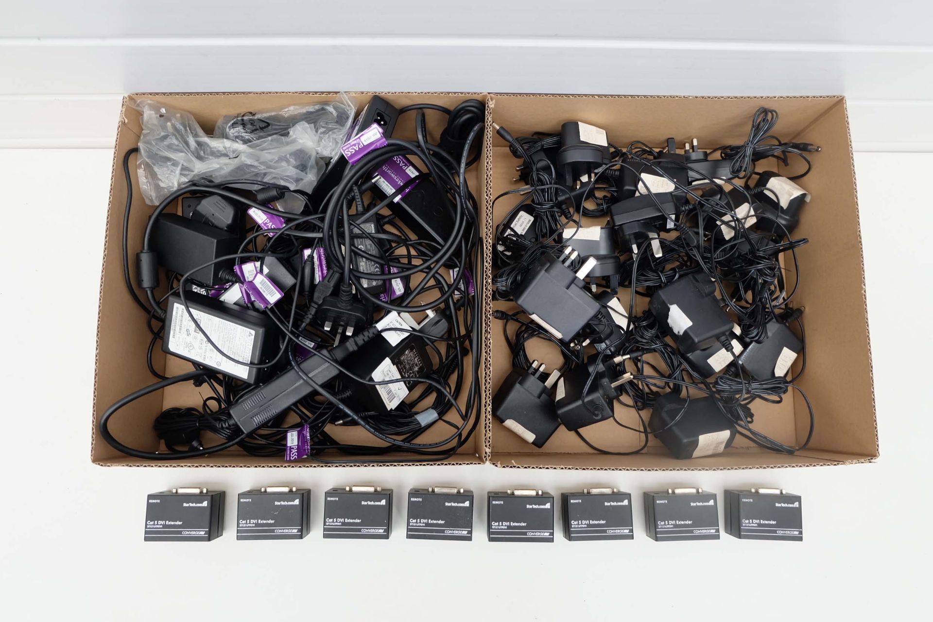 Quantity of Power Packs, Phone Adaptors & Cat 5 Extenders DVI.