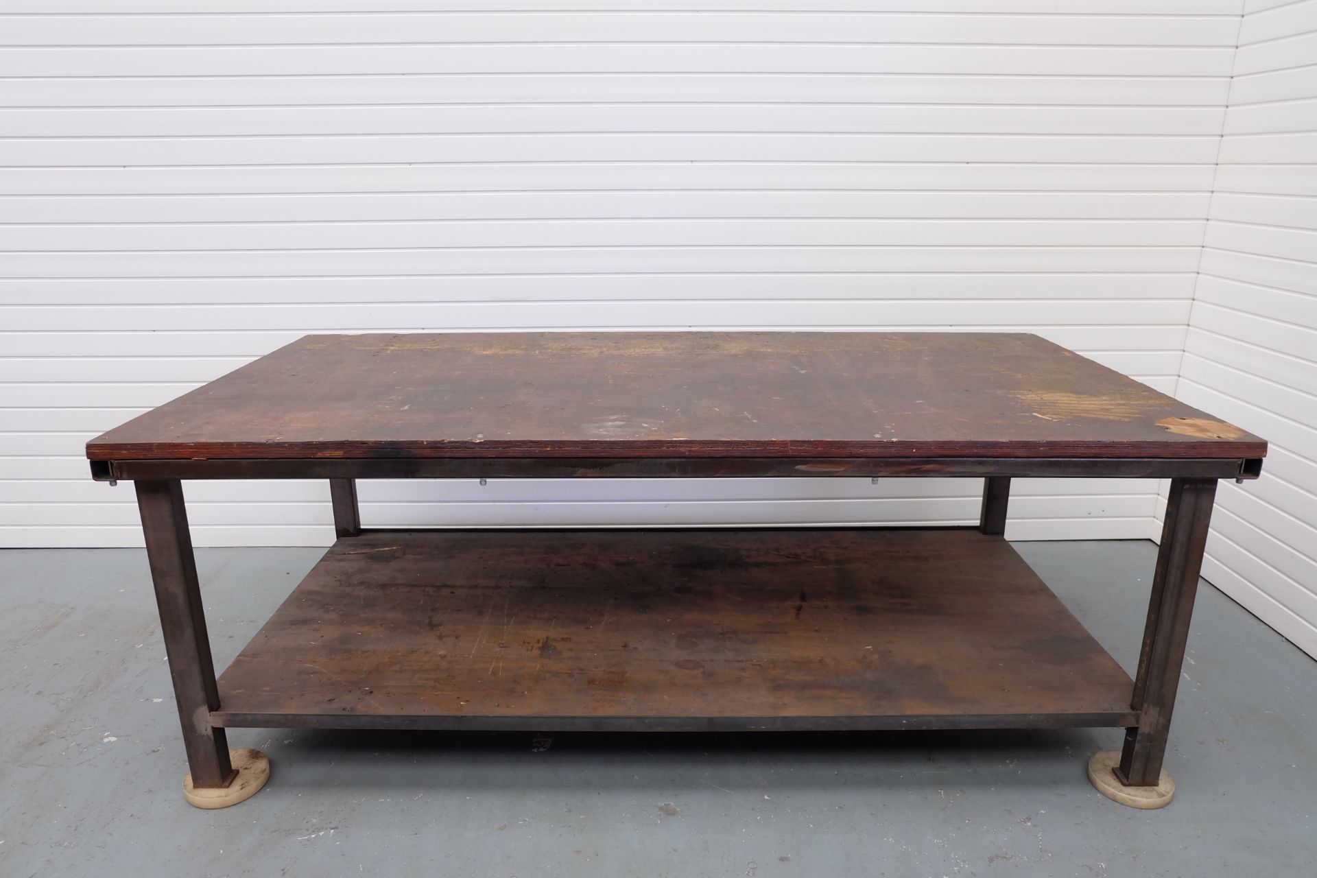 Heavy Duty Work Bench. Steel Frame With 1 1/2" Wooden Top. Size 8' x 4'. Height 35".