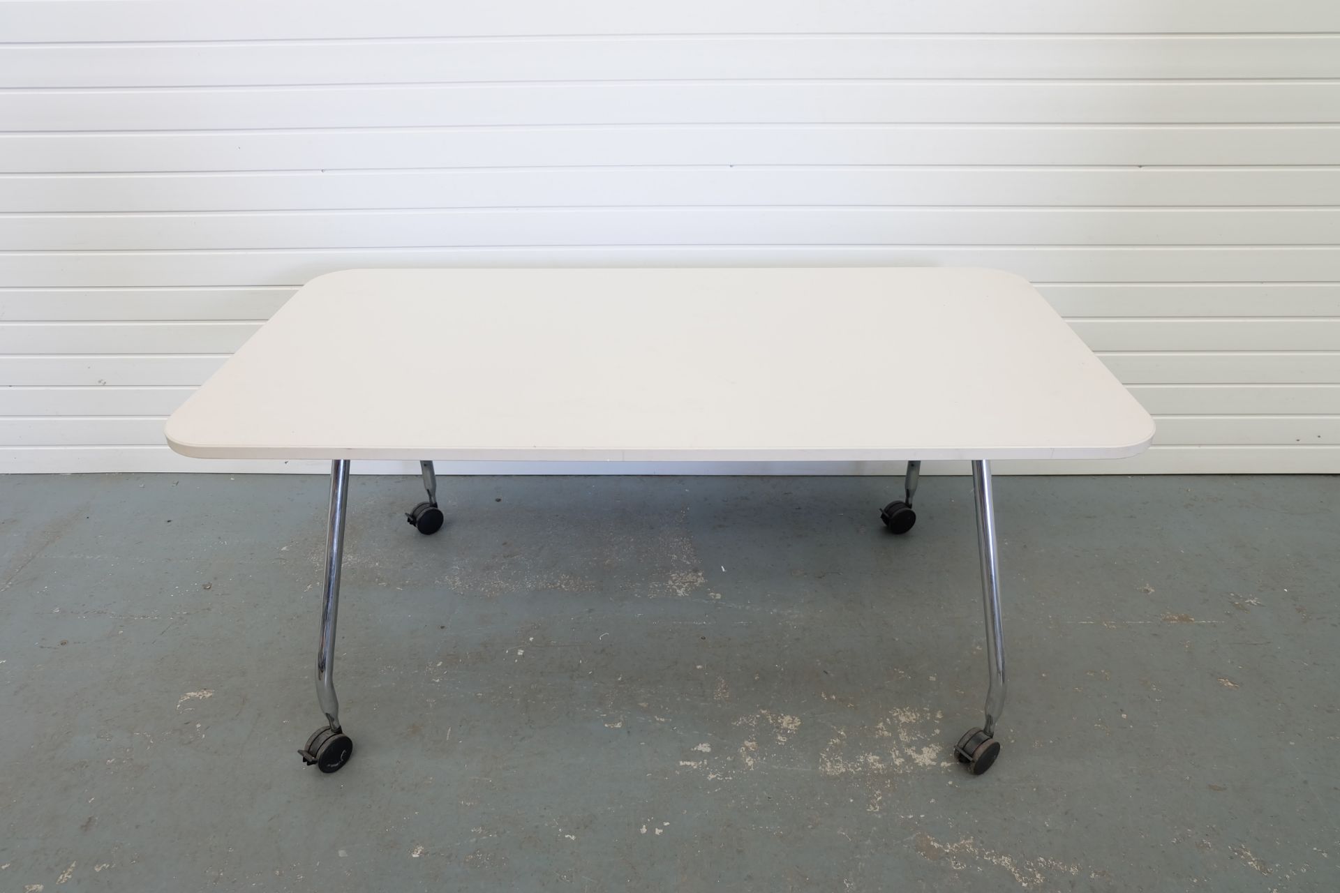 Chrome Legged Table on Wheels. Size 1600mm x 800mm x 720mm High.