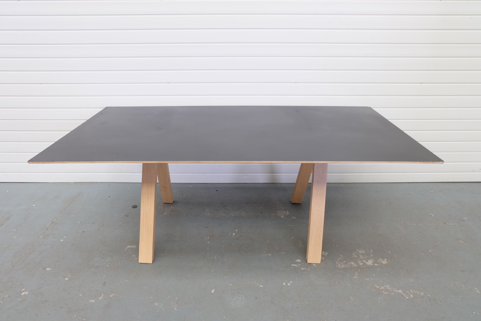 Black Top Desk With Wooden Legs. Size 2000mm x 1000mm x 745mm High.