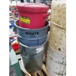 Pallet of trash cans and containment barrels.