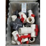 Tote of PVC shut off valves.