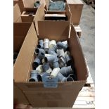 Box of assorted PVC fittings.