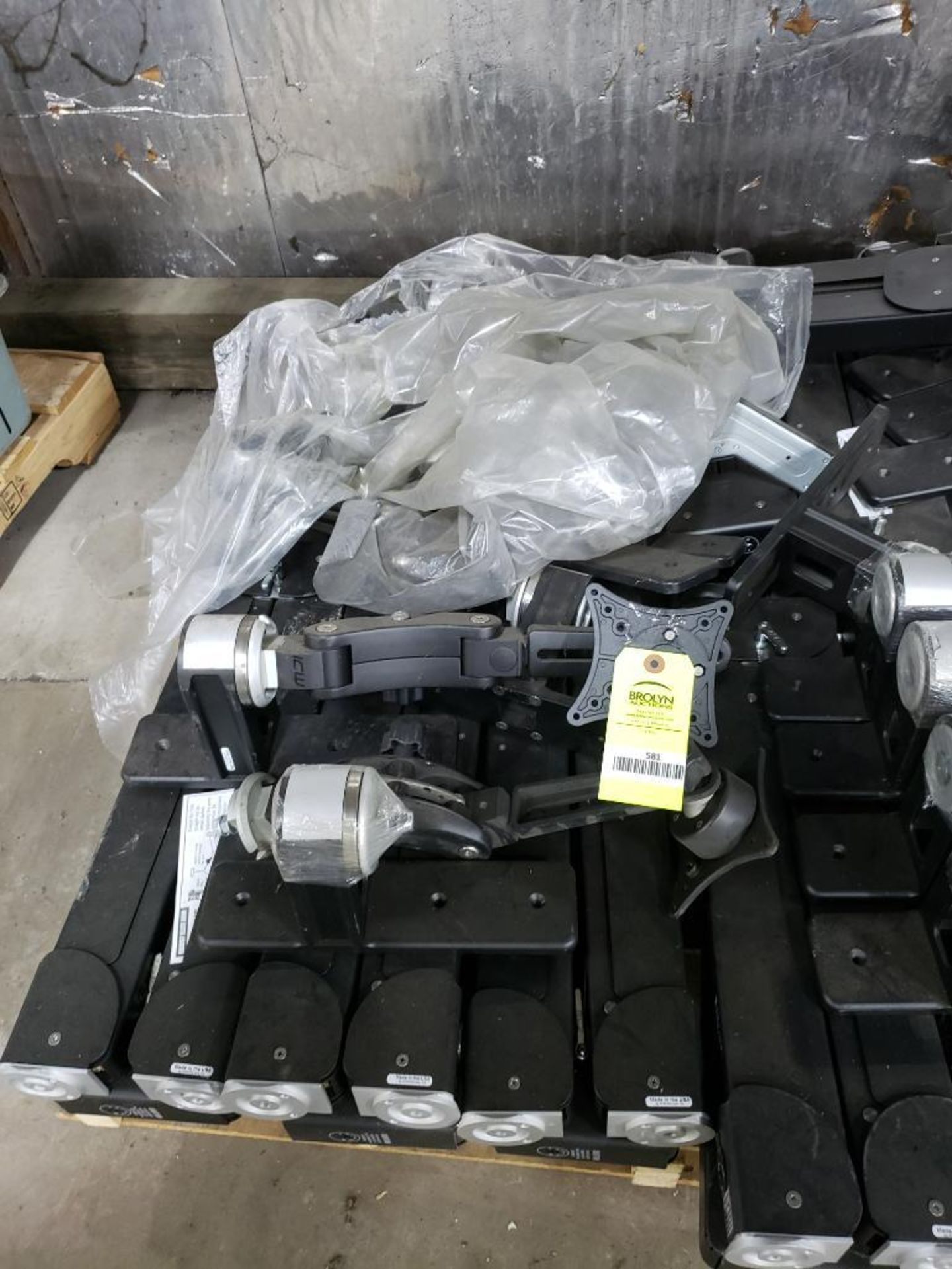 Pallet of assorted monitor mounts.