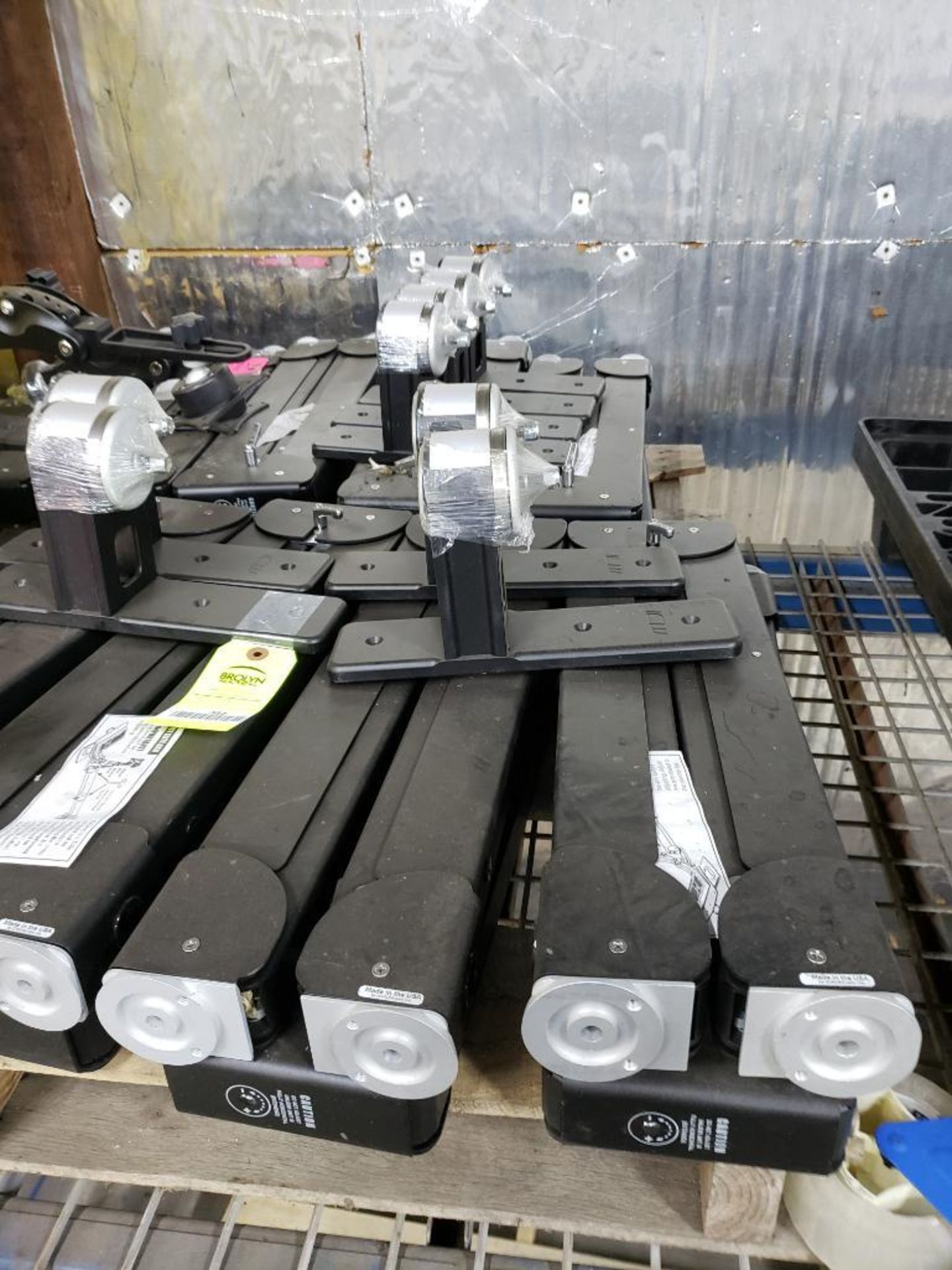 Pallet of monitor mount brackets.