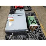 Pallet with assorted welding power supply components.