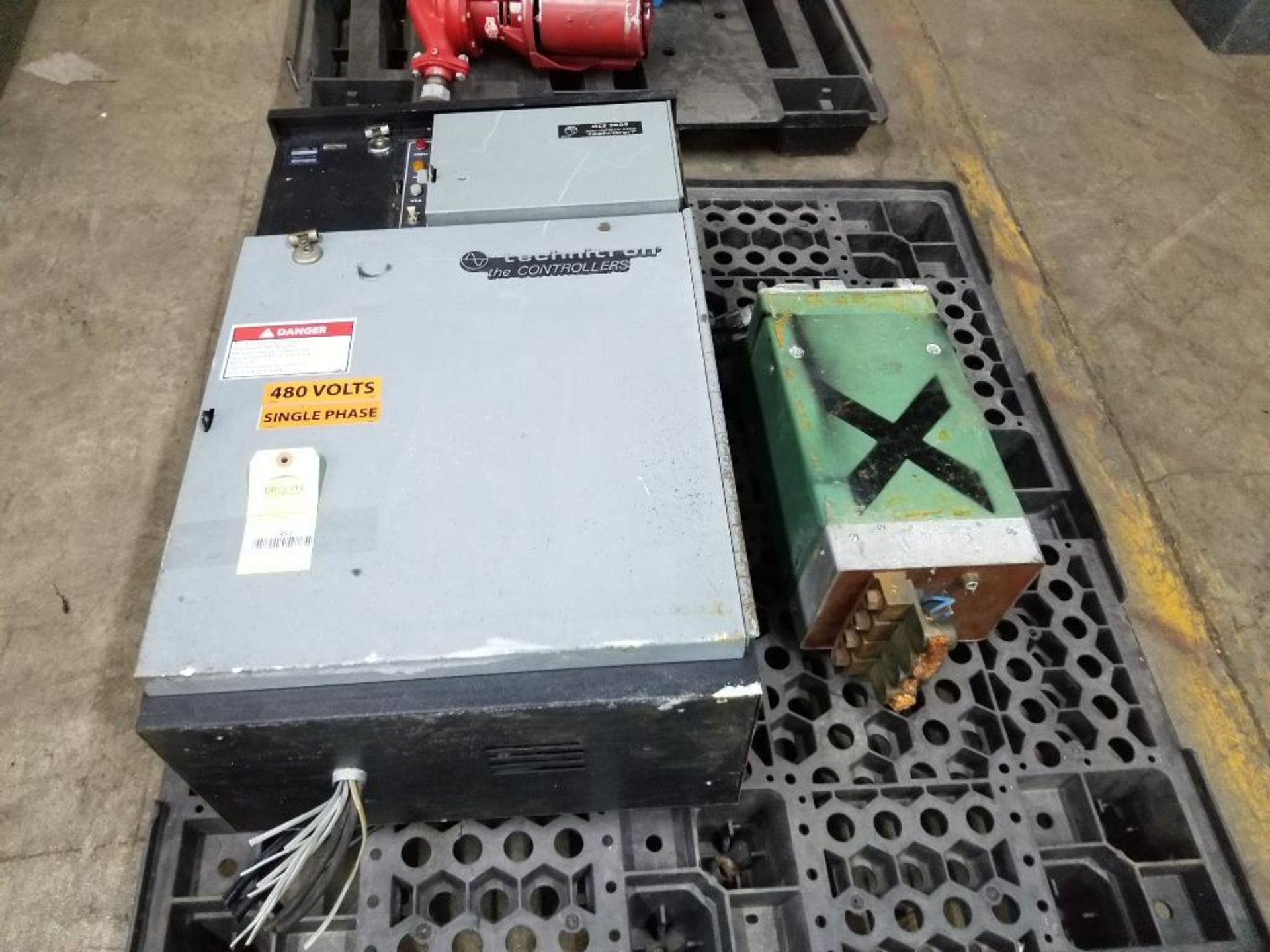 Pallet with assorted welding power supply components.