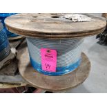 Roll of coated multi-strand steel cable.