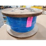 Roll of coated multi-strand steel cable.