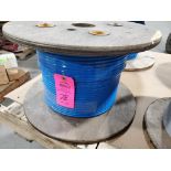 Roll of coated multi-strand steel cable.