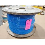 Roll of coated multi-strand steel cable.