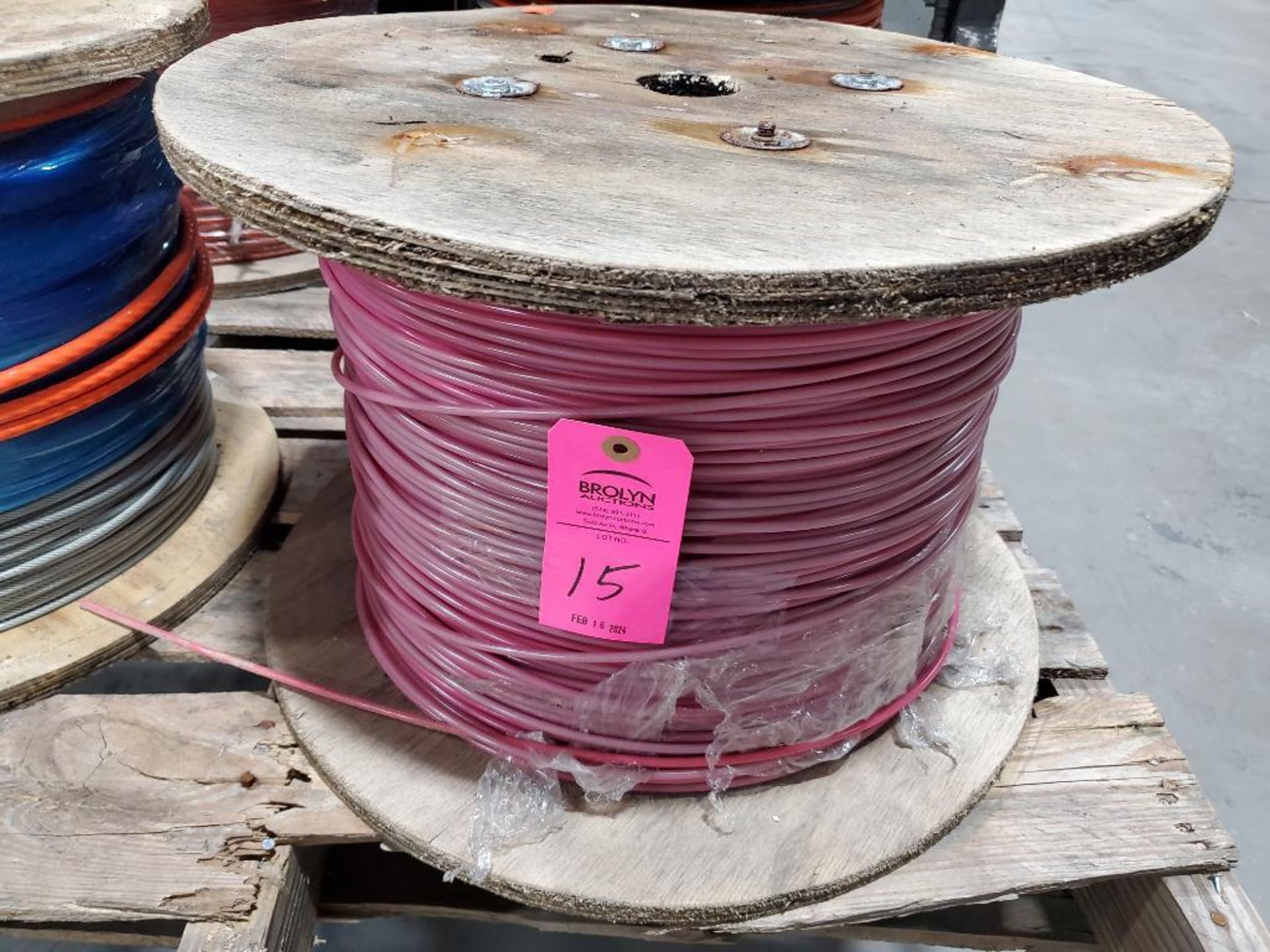 Roll of coated multi-strand steel cable.