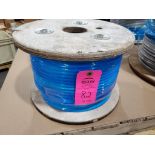 Roll of coated multi-strand steel cable.