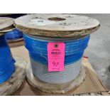 Roll of coated multi-strand steel cable.