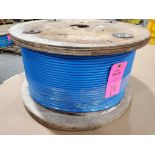 Roll of coated multi-strand steel cable.