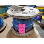 Roll of coated multi-strand steel cable.