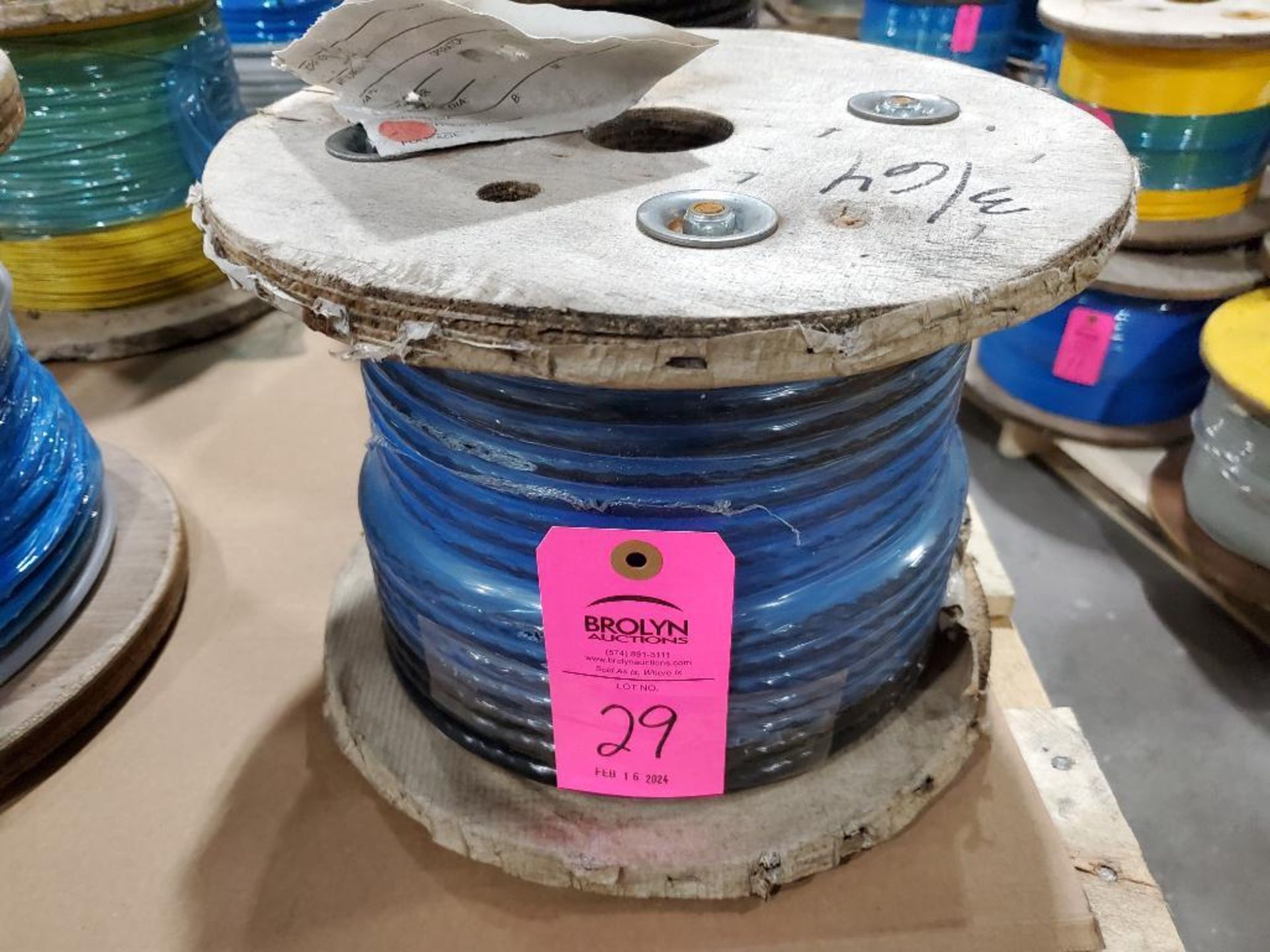 Roll of coated multi-strand steel cable.