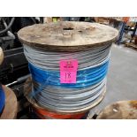 Roll of coated multi-strand steel cable.