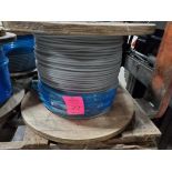 Roll of coated multi-strand steel cable.