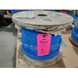 Roll of coated multi-strand steel cable.