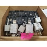 Assorted molded case breakers and high amp fuses.