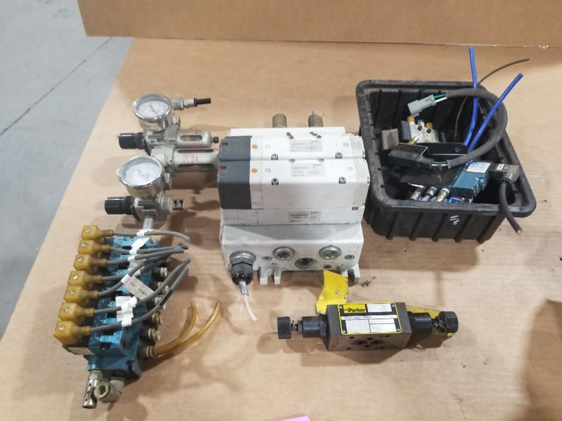 Assorted pneumatic valves and parts.