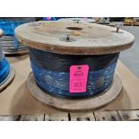 Roll of coated multi-strand steel cable.