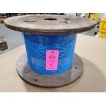 Roll of coated multi-strand steel cable.