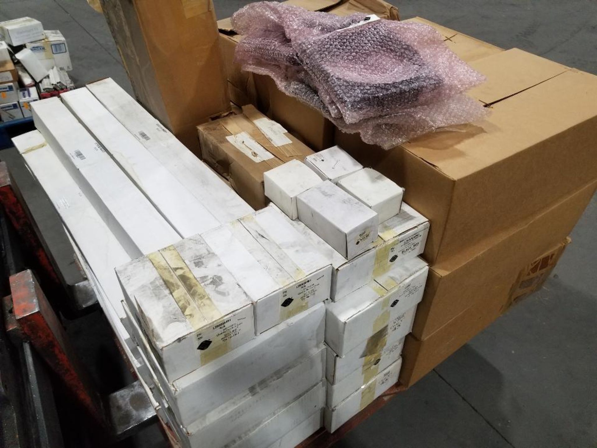 Pallet of assorted electrical and repair parts.