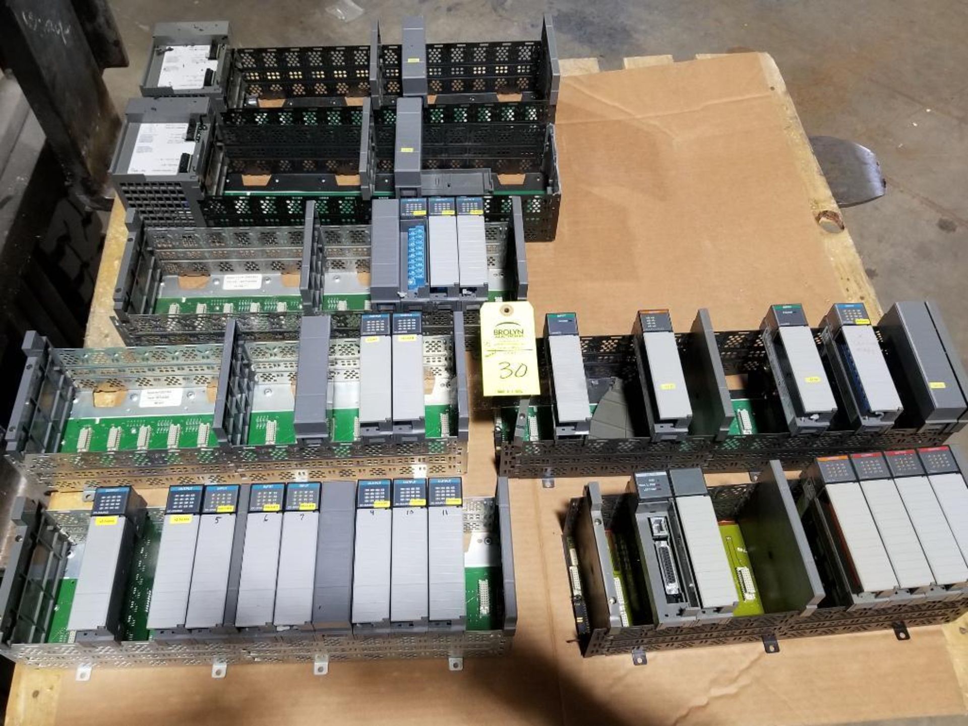 Large assortment Allen Bradley SLC PLC racks with power supplies and cards.