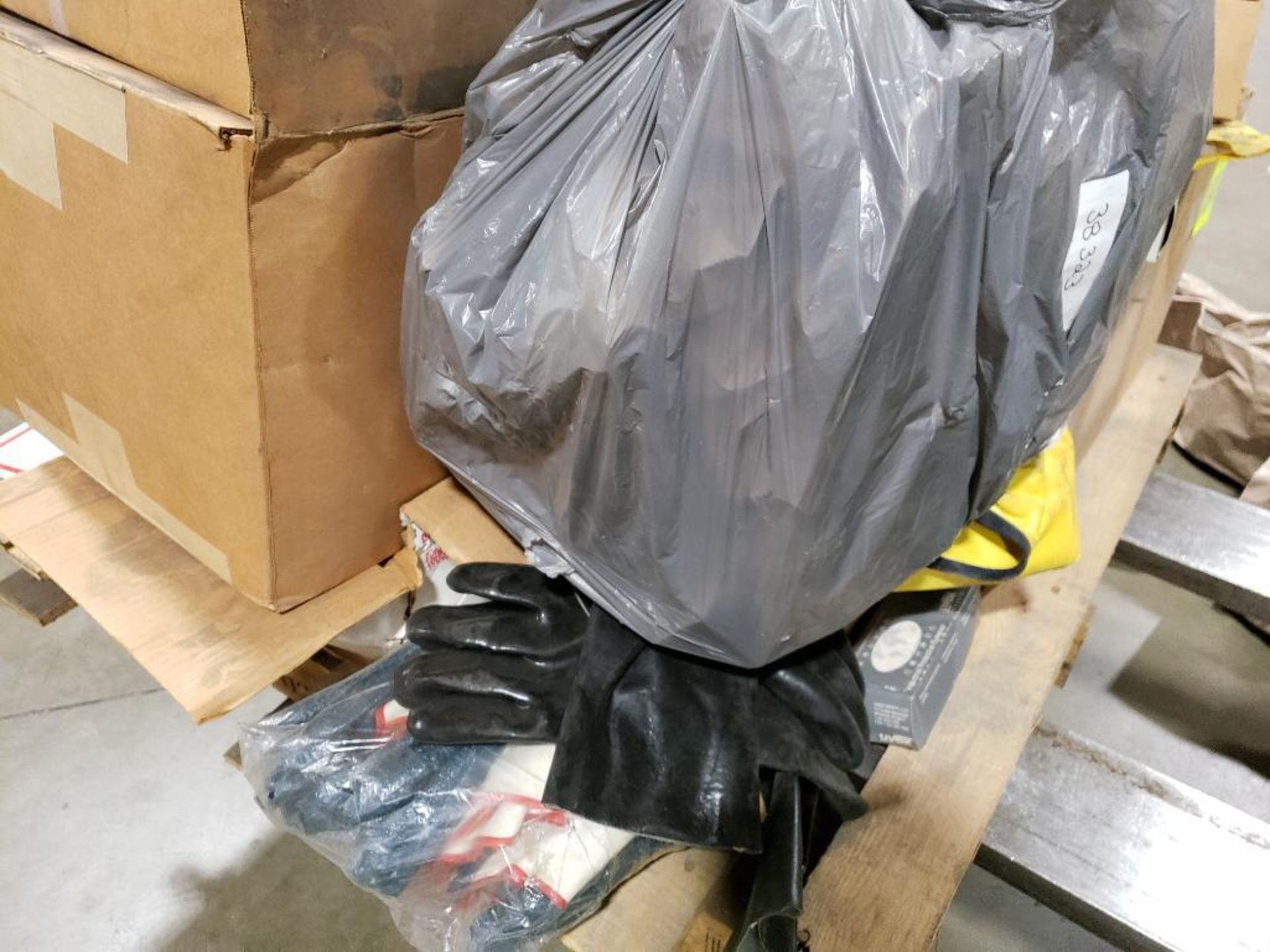 Pallet of assorted tarps, safety goggles, and other parts. - Image 11 of 23