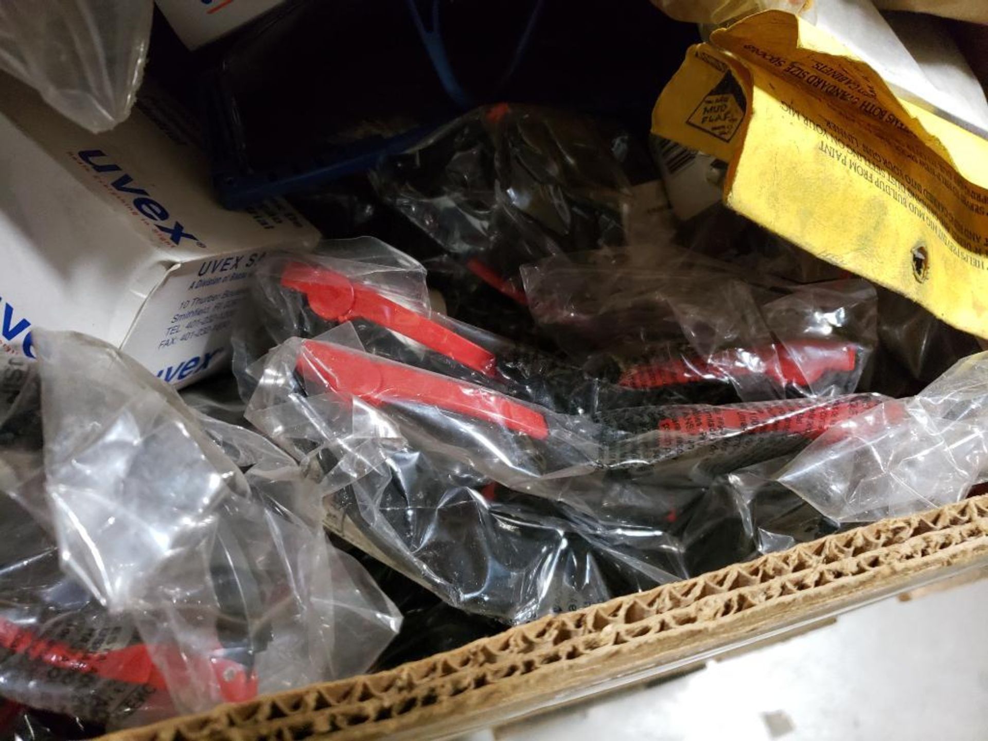 Pallet of assorted tarps, safety goggles, and other parts. - Image 2 of 23