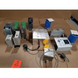 Large assortment of power supplies, capacitors, and electrical.