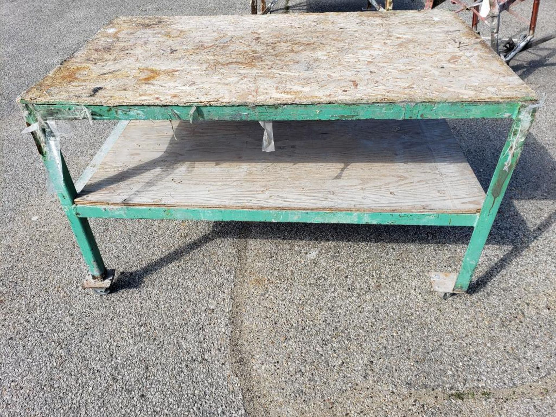 Heavy duty steel and wood table. 60in x 36in x 36in tall.