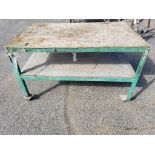 Heavy duty steel and wood table. 60in x 36in x 36in tall.