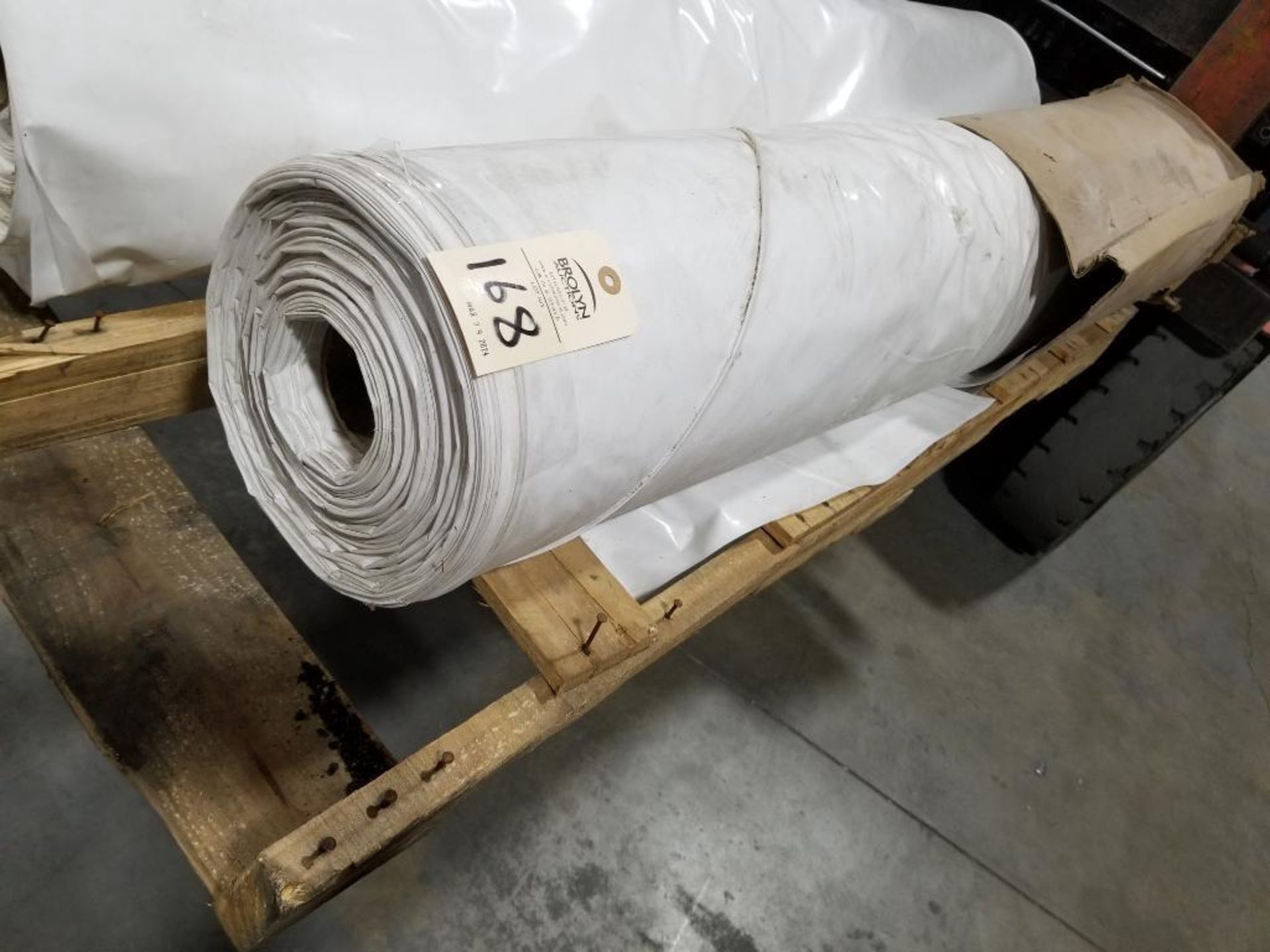 Large roll of plastic sheeting.