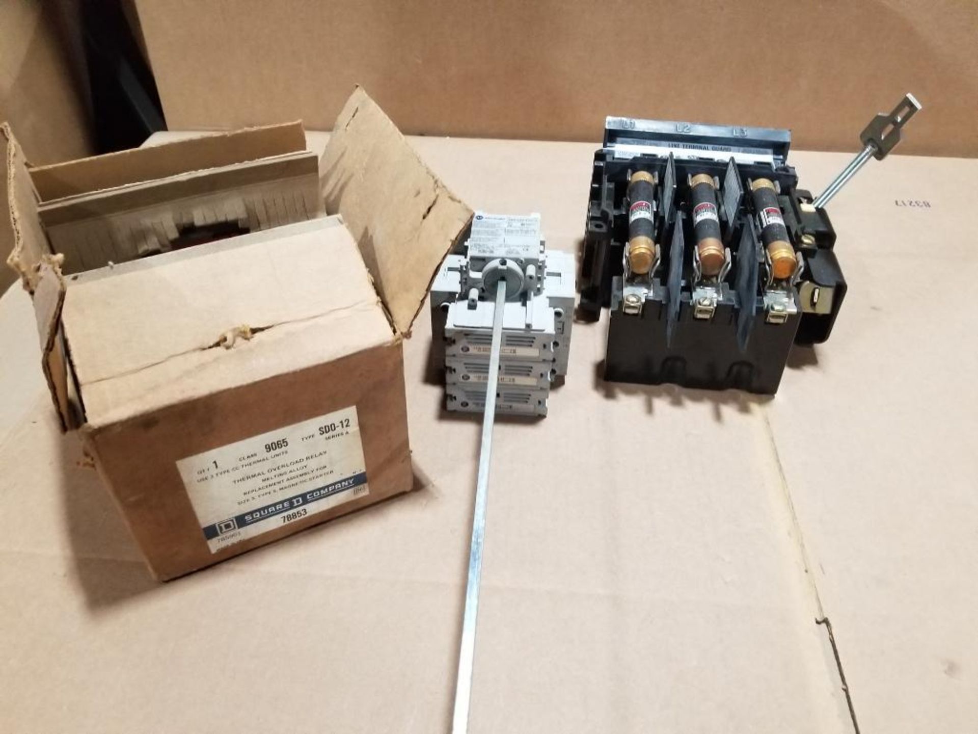 Assorted line terminal guards, thermal overload relay, and Allen Bradley shut off.