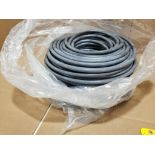 Large roll of coated rubber hose.