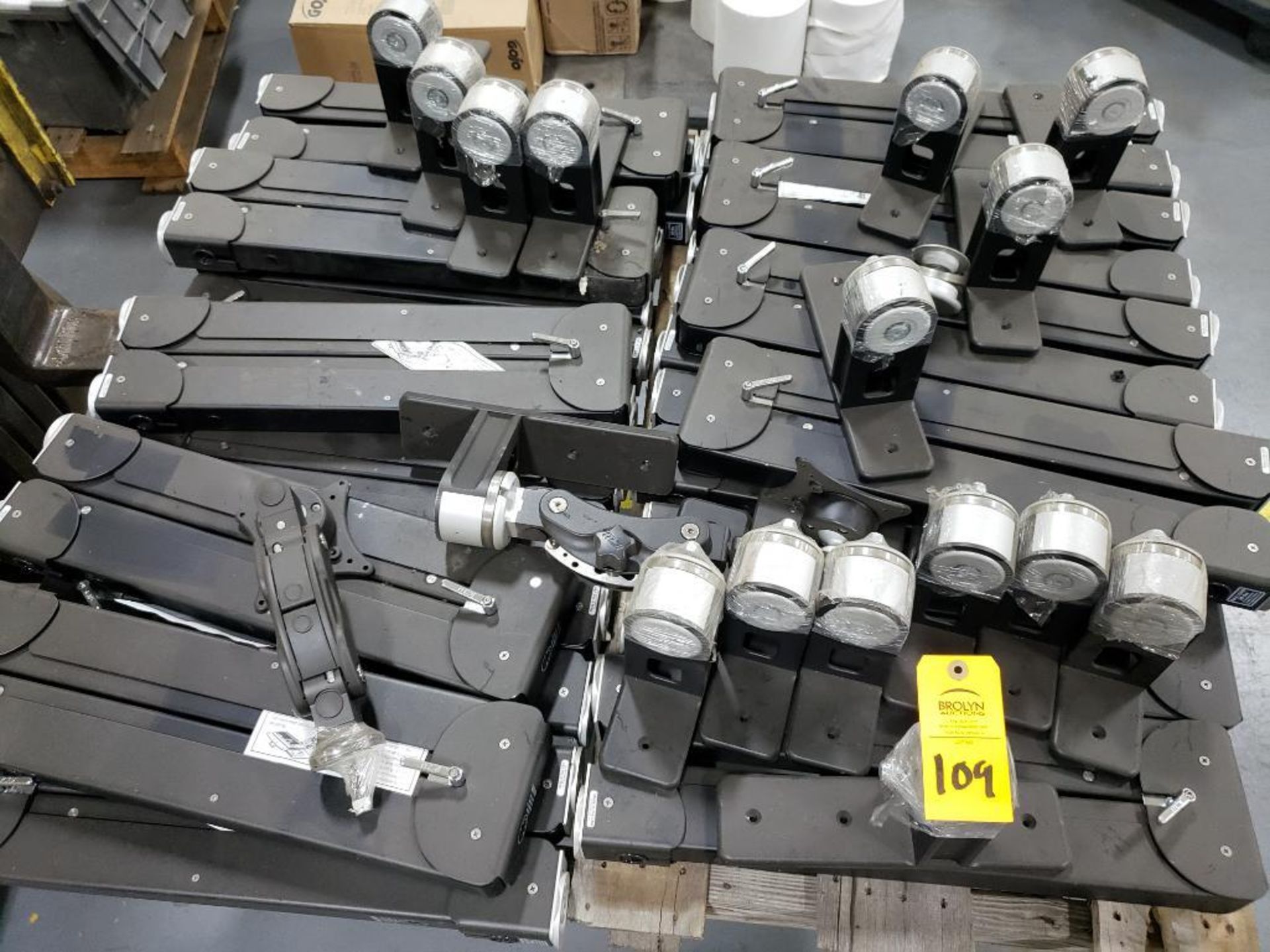 Pallet of assorted monitor mounts.