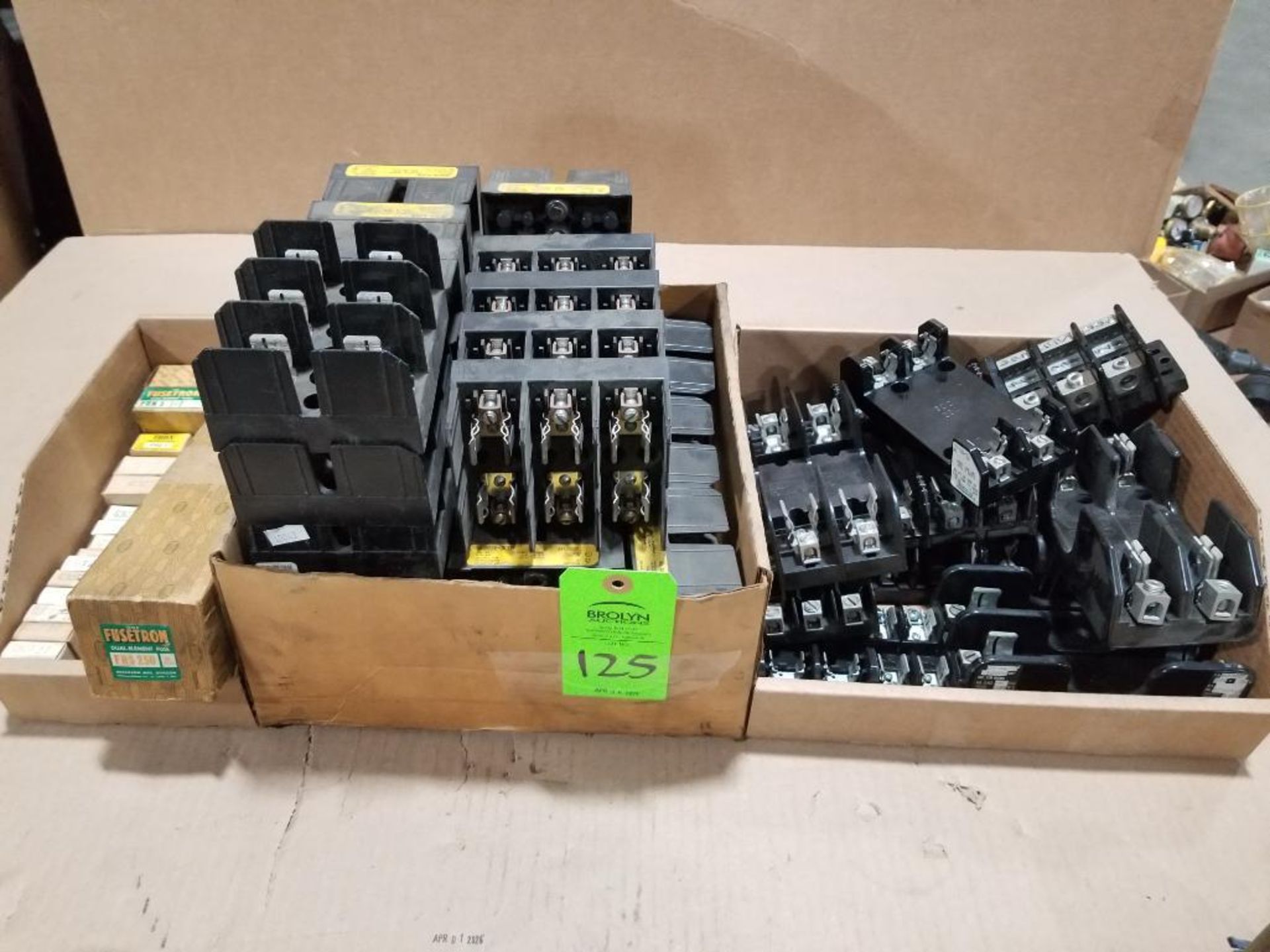 Large assortment of fuse holders and fuses.