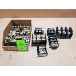 Assorted fuse holders, distribution lugs, and relays.