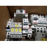 Large assortment of electrical and breakers.