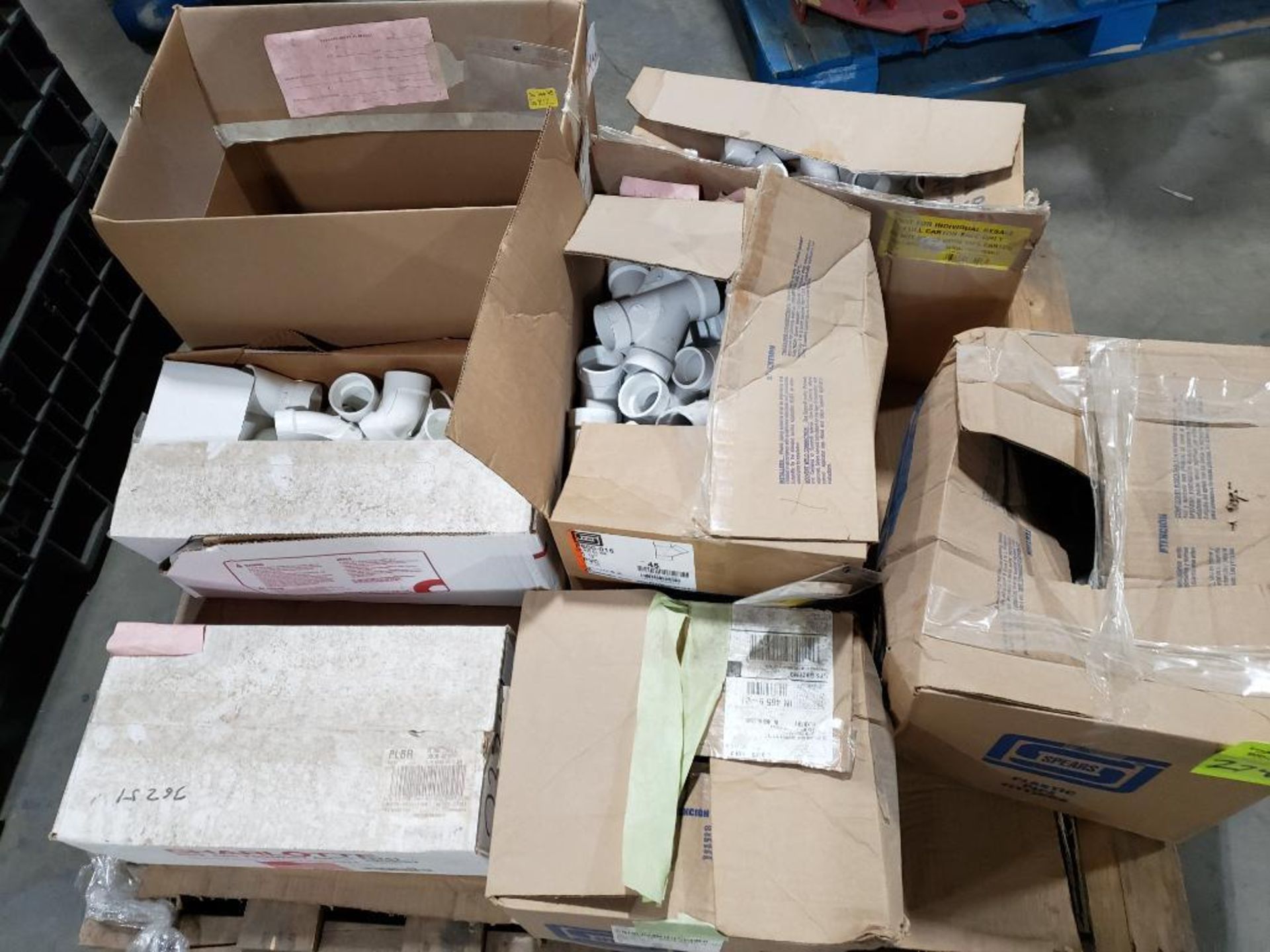 Pallet of assorted PVC fittings.
