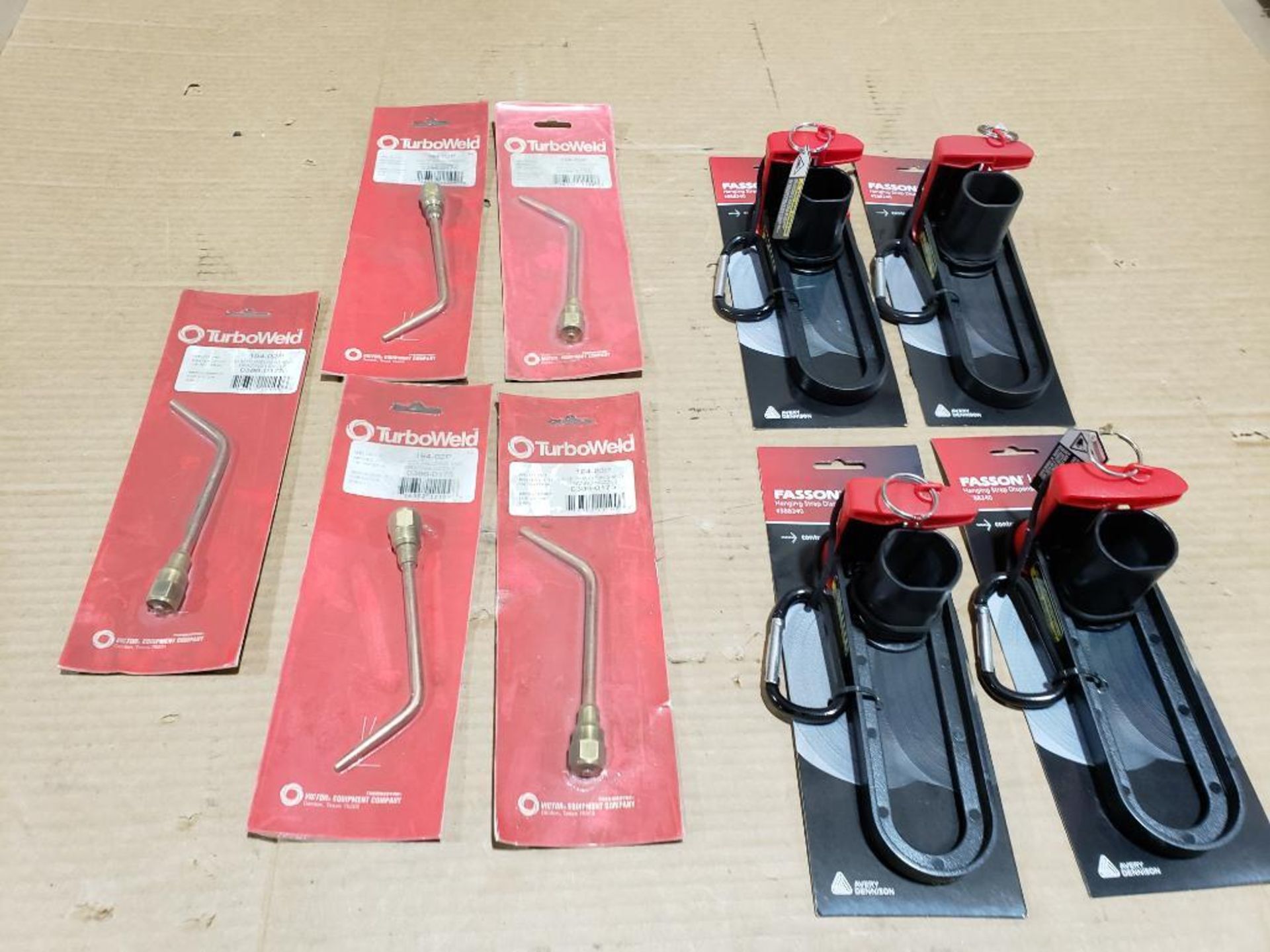 Assorted torch tips and hanging strap dispensers.