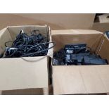 Assorted Dell docking stations and power supplies.