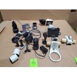 Large assortment of microscope parts.