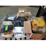 Pallet of assorted gloves and safety gear.